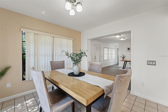 2708 W Bird St, Tampa, FL 33614 - dining area featuring light tile patterned flooring and a textured ceiling