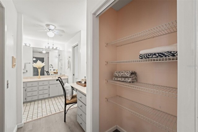 2708 W Bird St, Tampa, FL 33614 - full bath featuring double vanity, ceiling fan, and wood finished floors