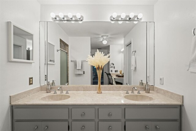 2708 W Bird St, Tampa, FL 33614 - bathroom featuring double vanity and a ceiling fan
