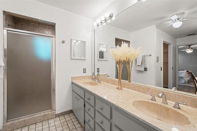 2708 W Bird St, Tampa, FL 33614 - full bathroom with ceiling fan, double vanity, a shower stall, and tile patterned floors