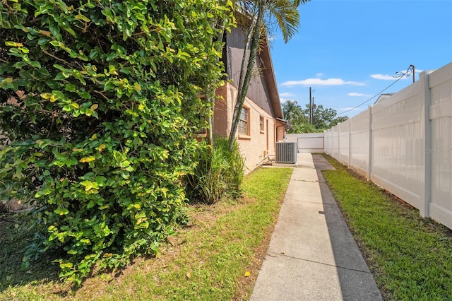 2708 W Bird St, Tampa, FL 33614 - view of side of home featuring a cooling unit and stucco siding