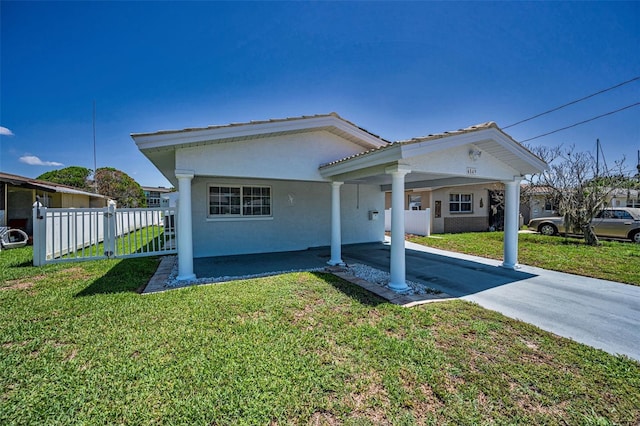 4849 Floramar Ter, New Port Richey, FL 34652 - view of front of house with stucco siding and an attached carport