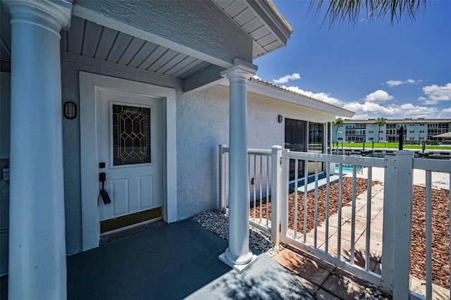 4849 Floramar Ter, New Port Richey, FL 34652 - doorway to property with stucco siding