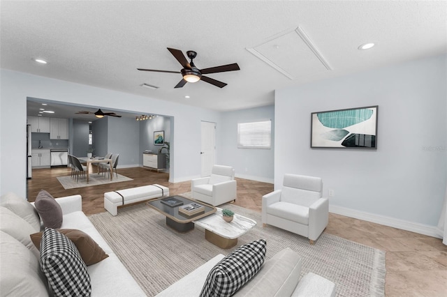 4849 Floramar Ter, New Port Richey, FL 34652 - living room featuring ceiling fan, attic access, recessed lighting, and a textured ceiling