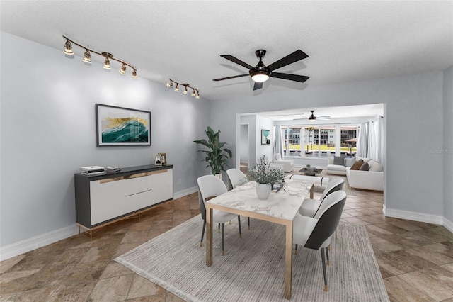 4849 Floramar Ter, New Port Richey, FL 34652 - dining room with ceiling fan, stone finish floors, and a textured ceiling
