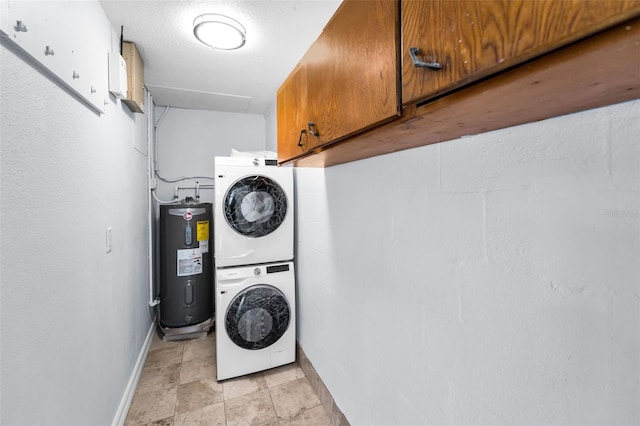 4849 Floramar Ter, New Port Richey, FL 34652 - laundry area with stacked washer and clothes dryer, electric water heater, and cabinet space