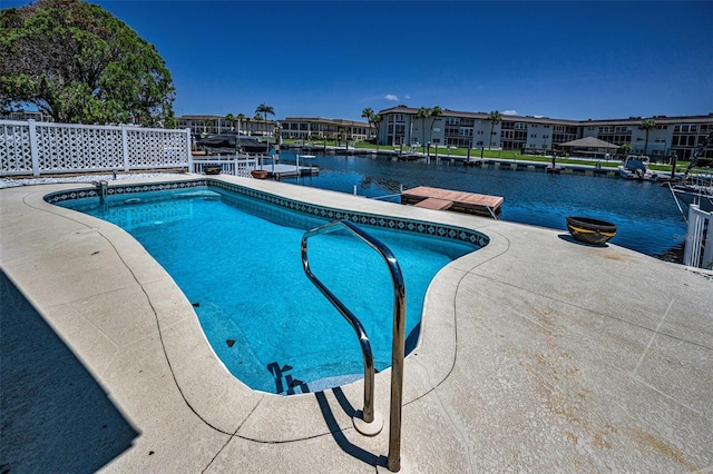 4849 Floramar Ter, New Port Richey, FL 34652 - view of swimming pool with a boat dock, a water view, and a residential view