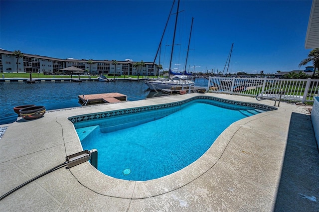 4849 Floramar Ter, New Port Richey, FL 34652 - swimming pool featuring a water view, a boat dock, and a patio