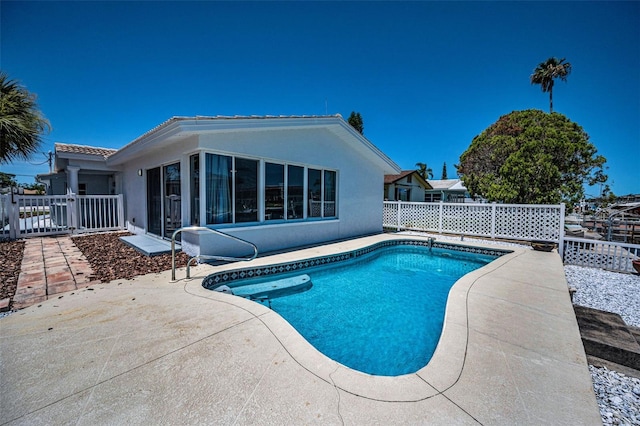 4849 Floramar Ter, New Port Richey, FL 34652 - view of swimming pool with a patio