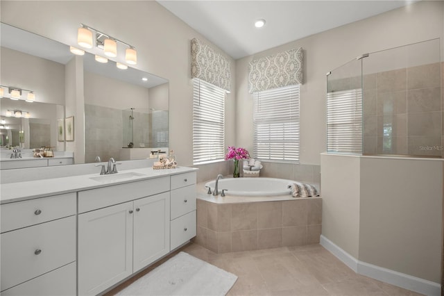 14162 Whittier Ln, Port Charlotte, FL 33981 - bathroom featuring a walk in shower, vanity, tile patterned flooring, a garden tub, and recessed lighting