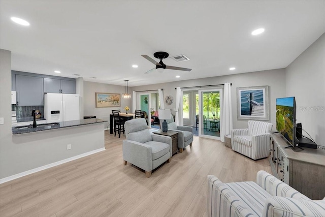 511 Foxglove Cir Unit B, Sun City Center, FL 33573 - living area featuring light wood-style flooring, ceiling fan, and recessed lighting