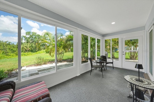 511 Foxglove Cir Unit B, Sun City Center, FL 33573 - sunroom / solarium featuring plenty of natural light, french doors, recessed lighting, and carpet flooring