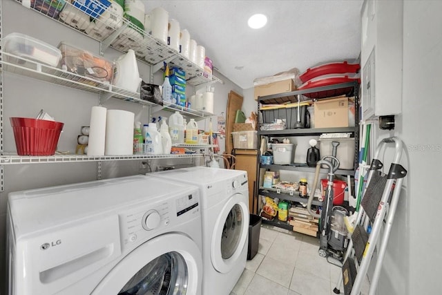 511 Foxglove Cir Unit B, Sun City Center, FL 33573 - laundry area featuring washing machine and clothes dryer and light tile patterned flooring