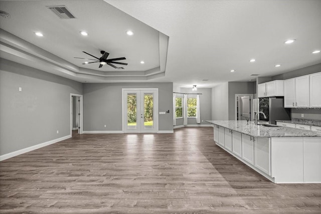 5352 W Corral Pl, Beverly Hills, FL 34465 - kitchen featuring open floor plan, stainless steel fridge with ice dispenser, french doors, white cabinetry, and light wood-style floors