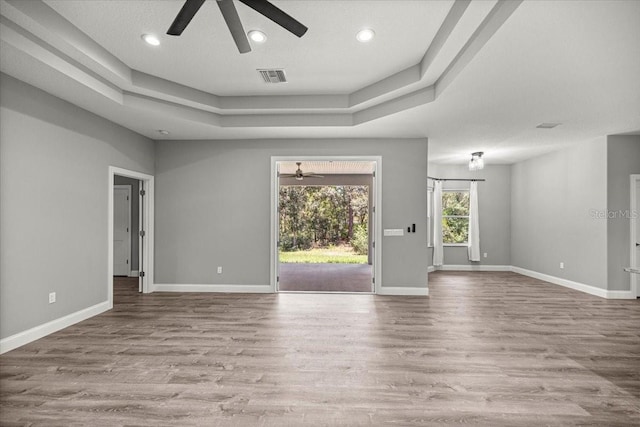 5352 W Corral Pl, Beverly Hills, FL 34465 - unfurnished room featuring ceiling fan, a raised ceiling, wood finished floors, and recessed lighting