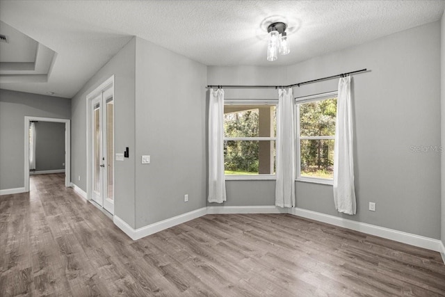 5352 W Corral Pl, Beverly Hills, FL 34465 - unfurnished room with wood finished floors and a textured ceiling