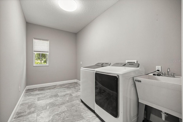 5352 W Corral Pl, Beverly Hills, FL 34465 - washroom featuring washing machine and clothes dryer and a textured ceiling