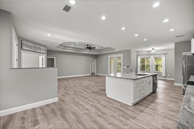 5352 W Corral Pl, Beverly Hills, FL 34465 - kitchen with recessed lighting, a raised ceiling, a ceiling fan, light stone counters, and white cabinets
