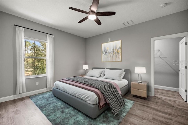 5352 W Corral Pl, Beverly Hills, FL 34465 - bedroom with wood finished floors and a ceiling fan