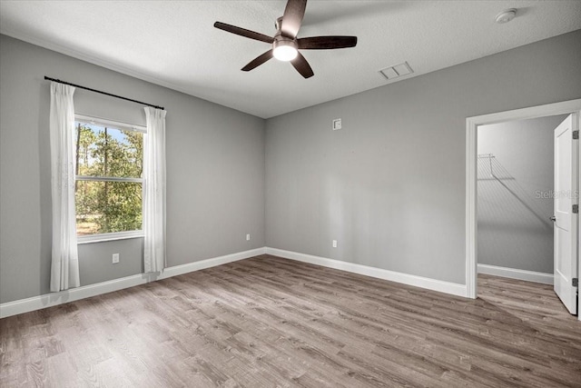 5352 W Corral Pl, Beverly Hills, FL 34465 - empty room featuring wood finished floors, ceiling fan, and a smoke detector