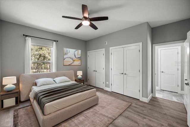 5352 W Corral Pl, Beverly Hills, FL 34465 - bedroom with two closets, wood finished floors, and ceiling fan