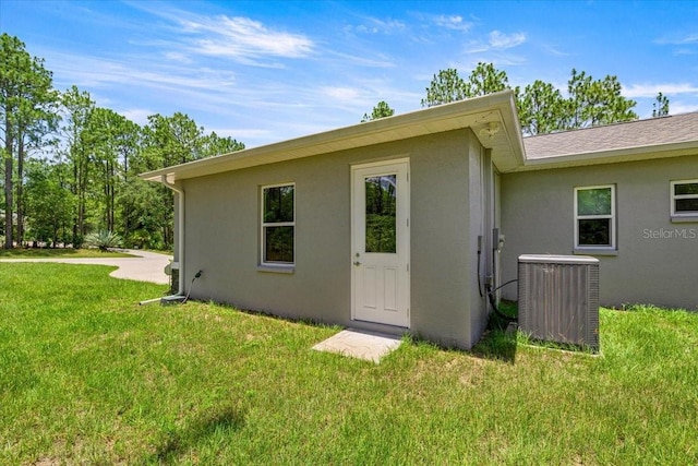 5352 W Corral Pl, Beverly Hills, FL 34465 - view of side of property with stucco siding and a yard