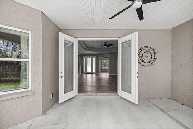 5352 W Corral Pl, Beverly Hills, FL 34465 - view of exterior entry with stucco siding, a ceiling fan, and a patio area