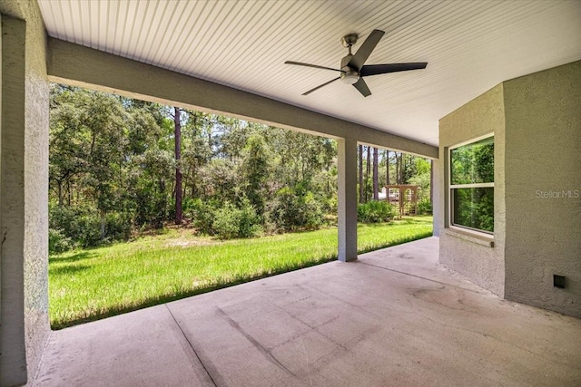 5352 W Corral Pl, Beverly Hills, FL 34465 - view of patio / terrace with ceiling fan and view of scattered trees