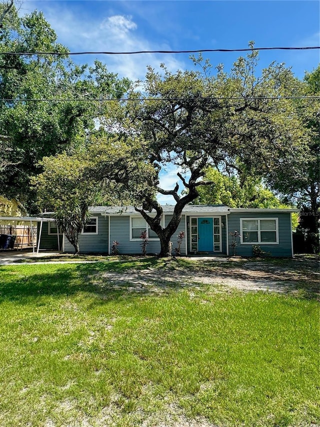 1507 W Le Compte Dr, Tampa, FL 33604 - view of grassy yard with a carport