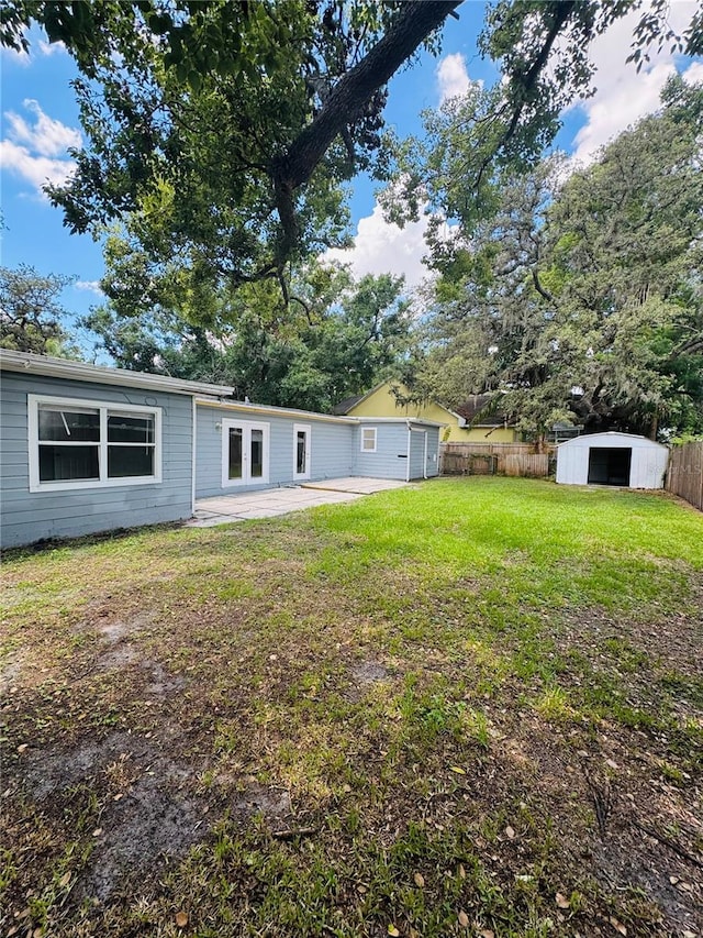 1507 W Le Compte Dr, Tampa, FL 33604 - rear view of house featuring a patio and a storage unit