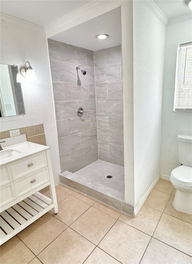 1507 W Le Compte Dr, Tampa, FL 33604 - bathroom featuring ornamental molding, a tile shower, vanity, and tile patterned floors