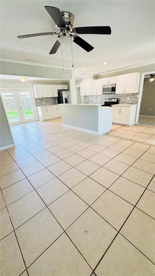 1507 W Le Compte Dr, Tampa, FL 33604 - unfurnished living room featuring light tile patterned floors, a ceiling fan, recessed lighting, and french doors