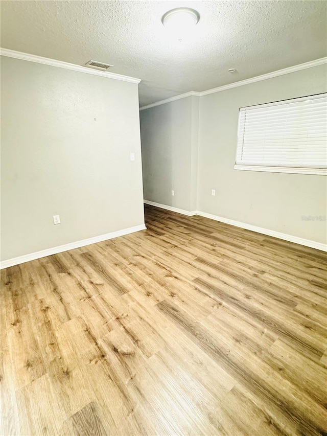 1507 W Le Compte Dr, Tampa, FL 33604 - unfurnished room featuring a textured ceiling, crown molding, and wood finished floors