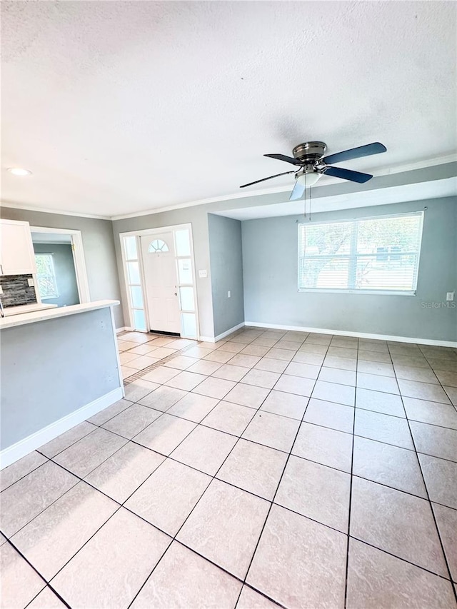 1507 W Le Compte Dr, Tampa, FL 33604 - unfurnished room featuring a textured ceiling, light tile patterned floors, healthy amount of natural light, and ceiling fan