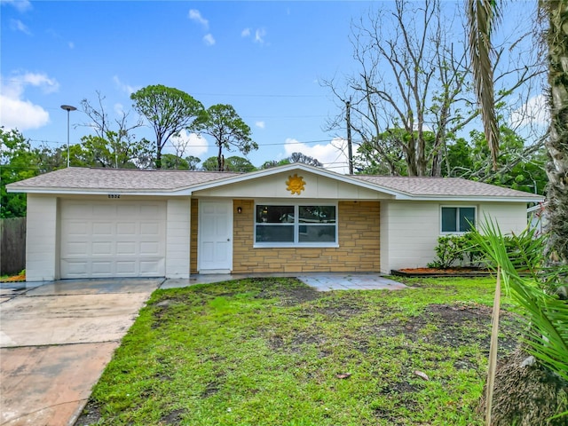 6632 Sierra Ter, New Port Richey, FL 34652 - single story home featuring an attached garage, driveway, roof with shingles, and a front yard