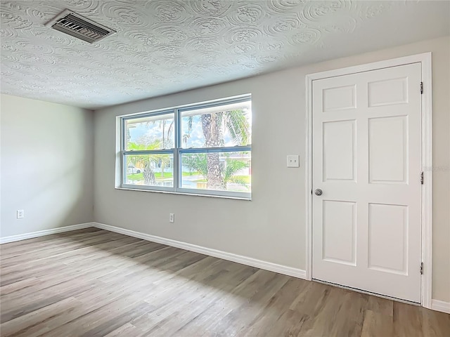 6632 Sierra Ter, New Port Richey, FL 34652 - unfurnished bedroom featuring wood finished floors