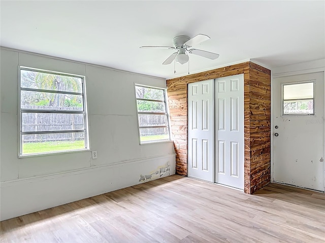 6632 Sierra Ter, New Port Richey, FL 34652 - unfurnished bedroom featuring wood finished floors, a closet, and ceiling fan