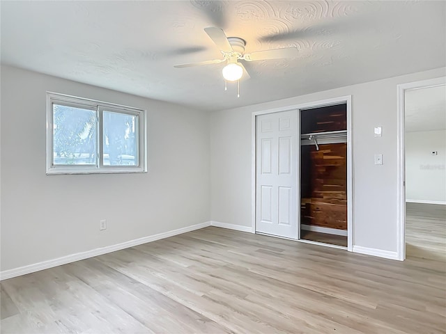 6632 Sierra Ter, New Port Richey, FL 34652 - unfurnished bedroom featuring light wood-style floors, a closet, and ceiling fan