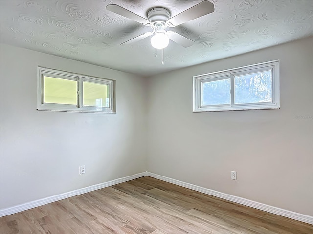 6632 Sierra Ter, New Port Richey, FL 34652 - empty room with light wood-style flooring and ceiling fan