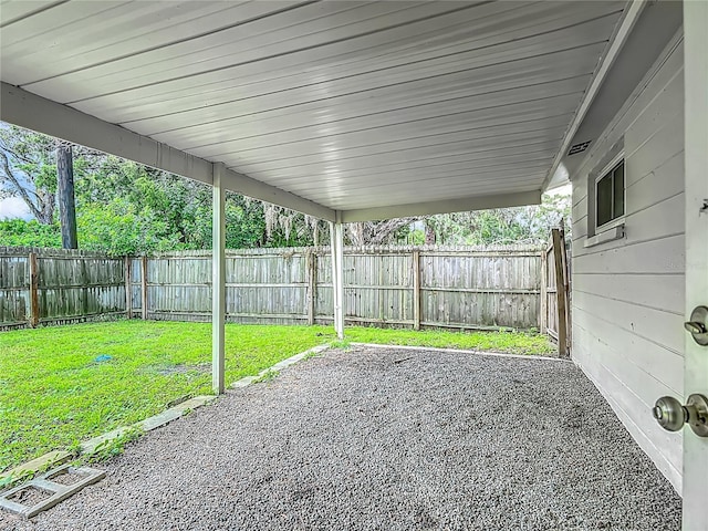 6632 Sierra Ter, New Port Richey, FL 34652 - fenced backyard featuring a patio area and a carport