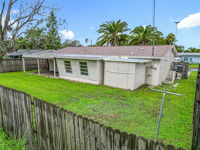 6632 Sierra Ter, New Port Richey, FL 34652 - rear view of house featuring a fenced backyard and a shingled roof