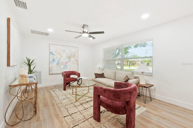 11779 82nd Ter, Seminole, FL 33772 - living room featuring light wood-style flooring, ceiling fan, and recessed lighting