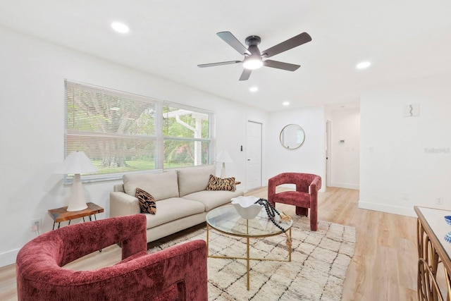 11779 82nd Ter, Seminole, FL 33772 - living room with light wood-style flooring, a ceiling fan, and recessed lighting