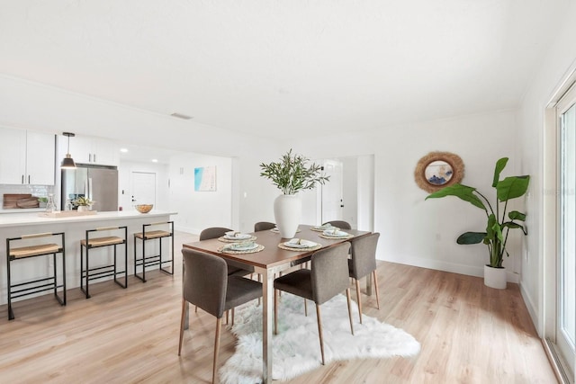 11779 82nd Ter, Seminole, FL 33772 - dining space with light wood-style flooring and baseboards