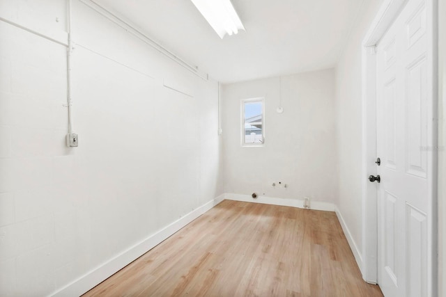 11779 82nd Ter, Seminole, FL 33772 - laundry area with light wood-style floors and baseboards