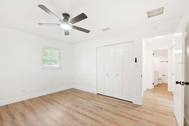 11779 82nd Ter, Seminole, FL 33772 - unfurnished bedroom featuring light wood-type flooring, a closet, and ceiling fan