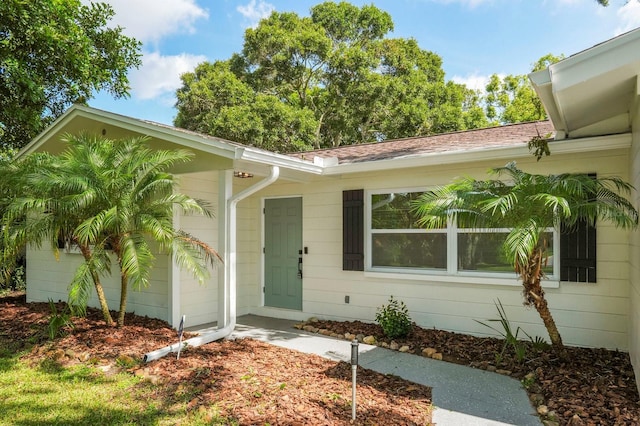 11779 82nd Ter, Seminole, FL 33772 - view of exterior entry featuring an attached garage