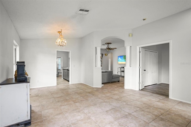 4948 Ridgemoor Cir, Palm Harbor, FL 34685 - unfurnished living room with a ceiling fan, light tile patterned floors, arched walkways, decorative columns, and plenty of natural light
