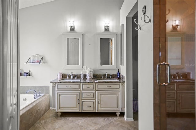 4948 Ridgemoor Cir, Palm Harbor, FL 34685 - bathroom featuring double vanity, a bath, and tile patterned floors
