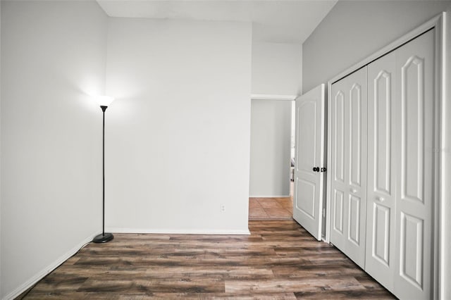 4948 Ridgemoor Cir, Palm Harbor, FL 34685 - unfurnished bedroom featuring dark wood-style floors and a closet